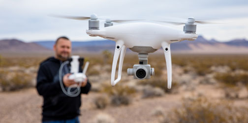 man controlling drone